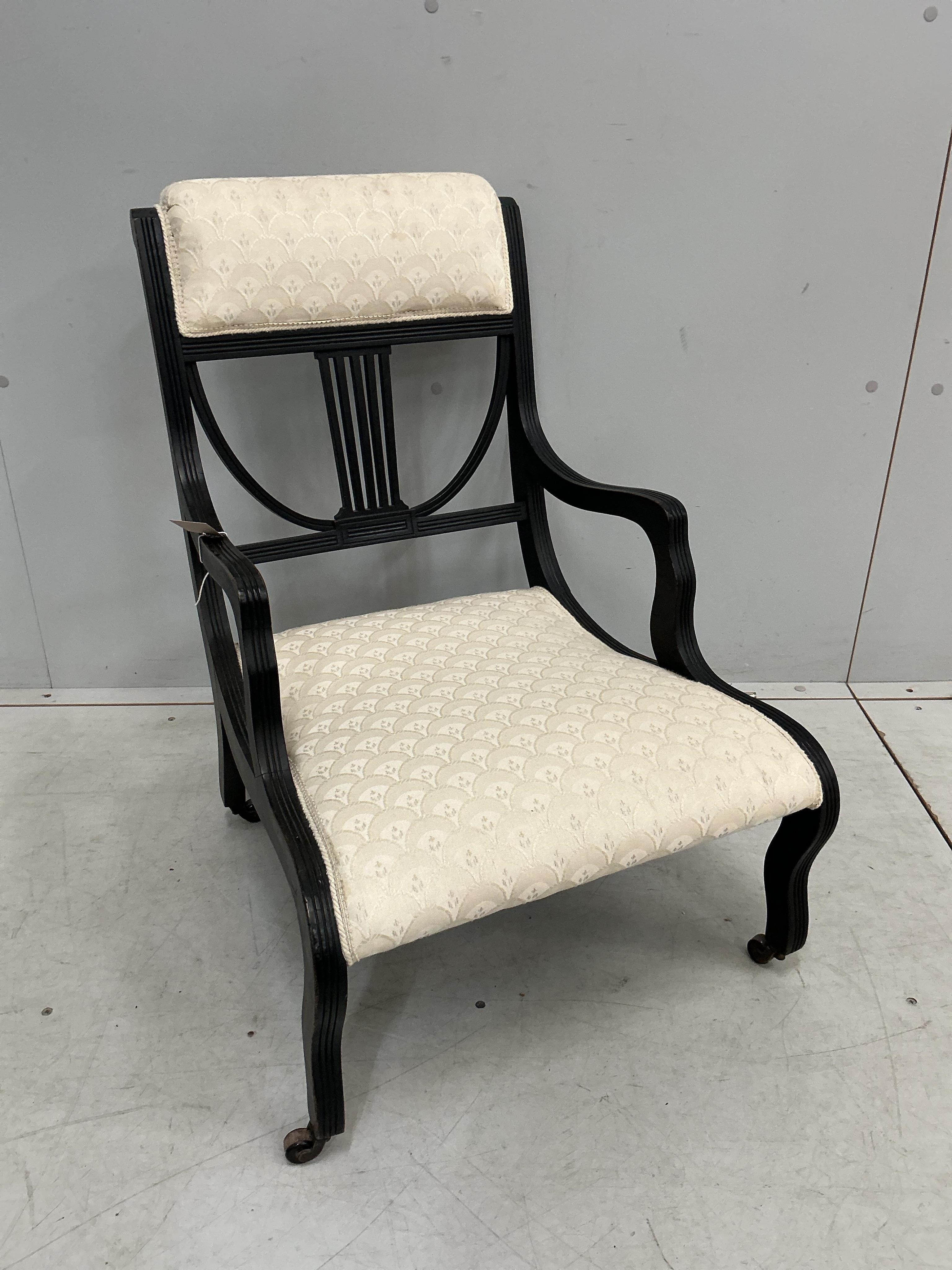 A late Victorian ebonised salon chair, width 47cm, depth 55cm, height 74cm